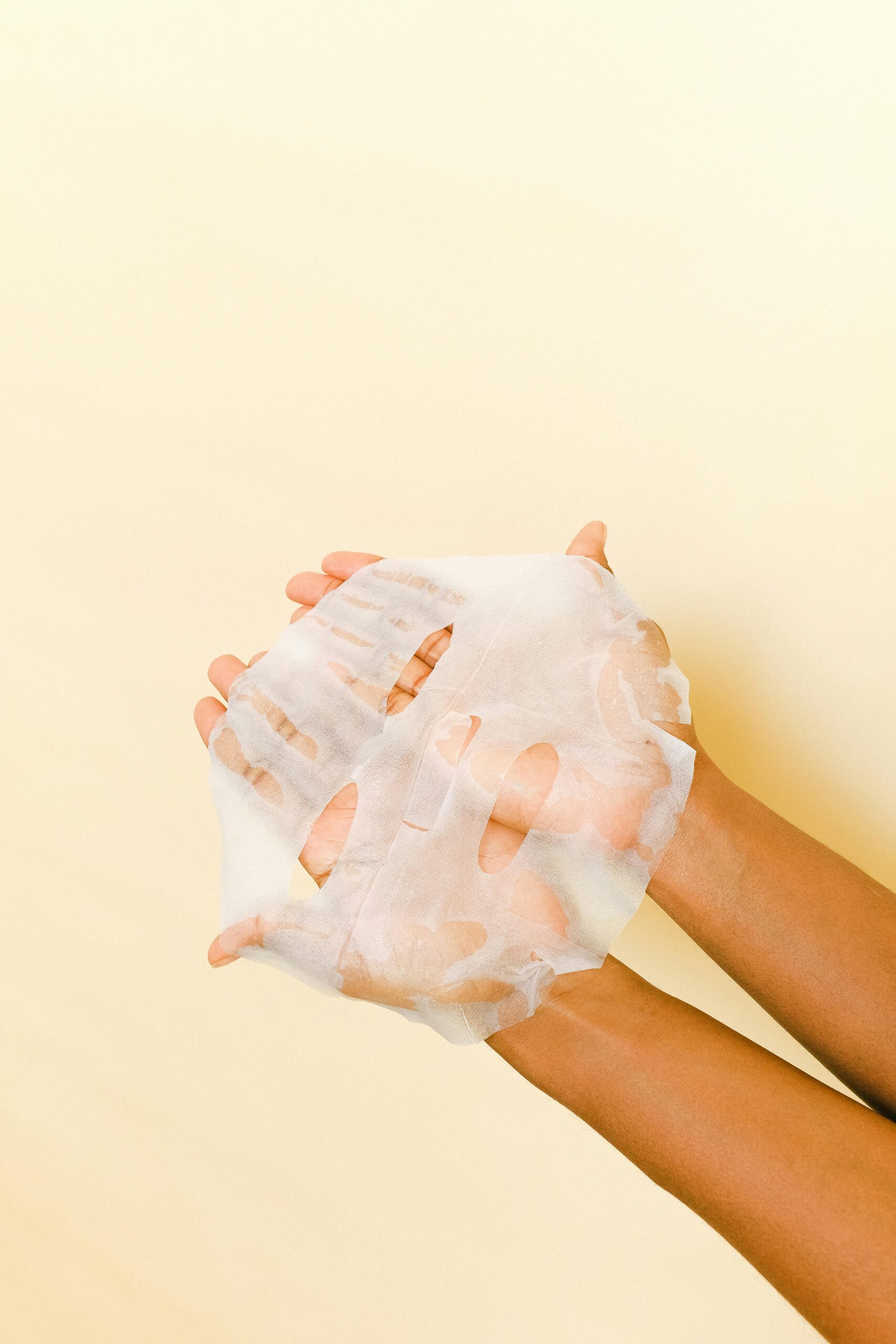 face sheet mask on the hands